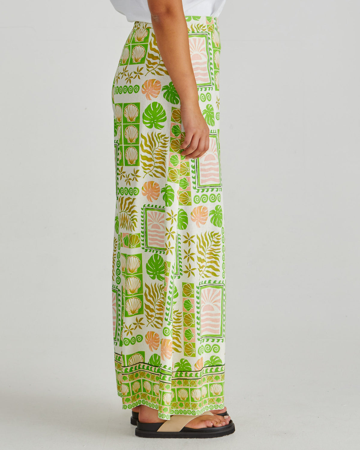 Side view and waist view of lady wearing the SASS Emmett Wide Leg Pant in tropical shell print with flat front and side pockets. Available at Loloma Living, Tamborine Mountain.