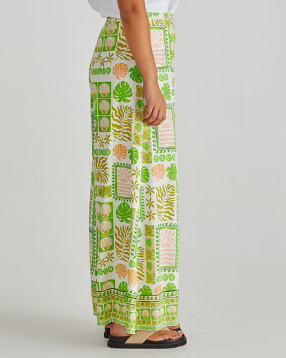Side view and waist view of lady wearing the SASS Emmett Wide Leg Pant in tropical shell print with flat front and side pockets. Available at Loloma Living, Tamborine Mountain.