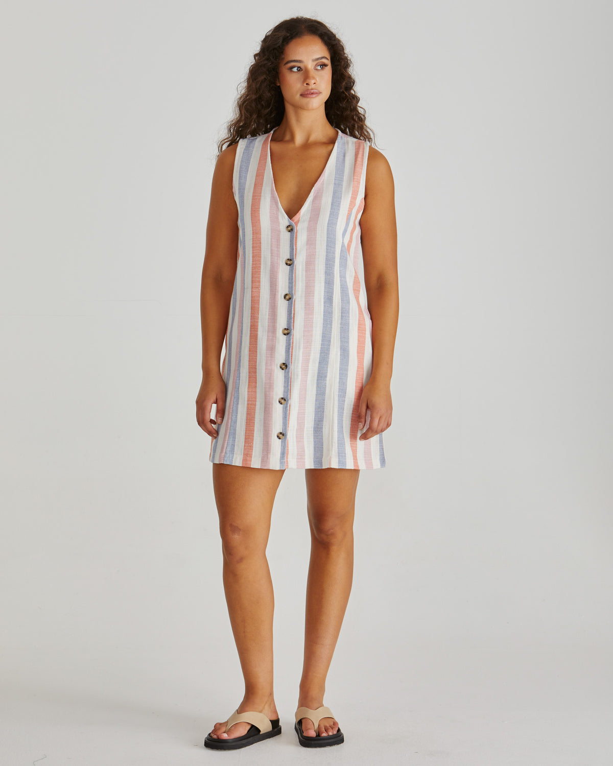 Front view of Lady wearing the SASS Travis Vest Dress in stripe with princess seam detail and side pockets. Linen combination.  Available at Loloma Living, Tamborine Mountain. Stockist of SASS and Betty Basics.