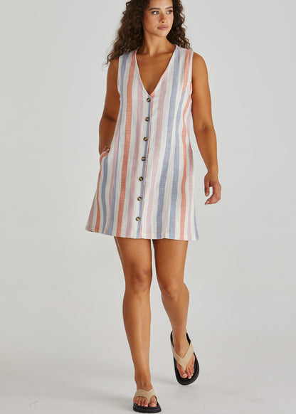 Lady wearing the SASS Travis Vest Dress in stripe with princess seam detail and side pockets. Linen combination.  Available at Loloma Living, Tamborine Mountain. Stockist of SASS and Betty Basics.