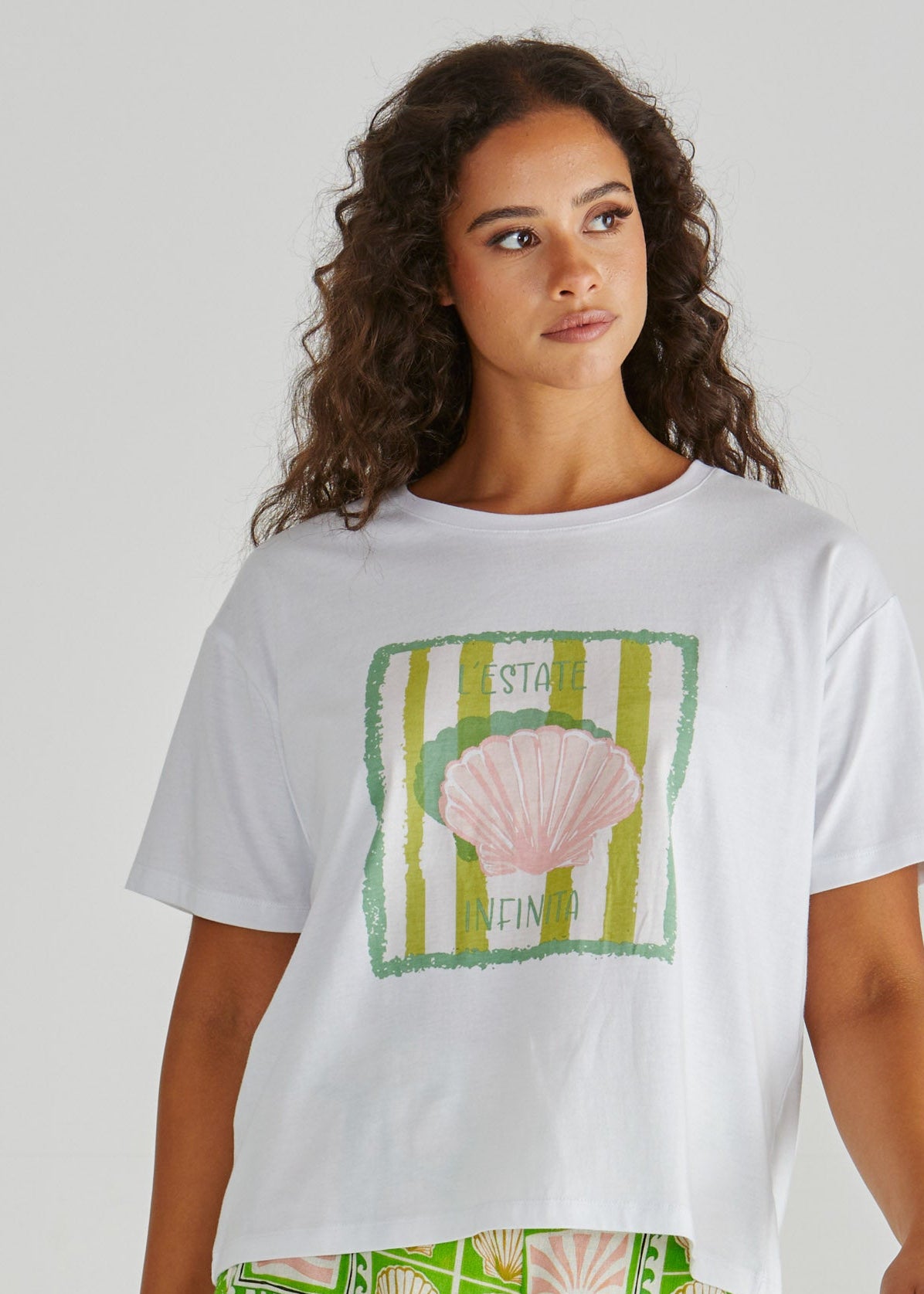 Lady wearing the SASS Cynthia Tee in exclusive seashell stripe print with dropped shoulder and soft cotton jersey. Available at Loloma Living Tamborine Mountain - stockist of SASS and Betty Basics.