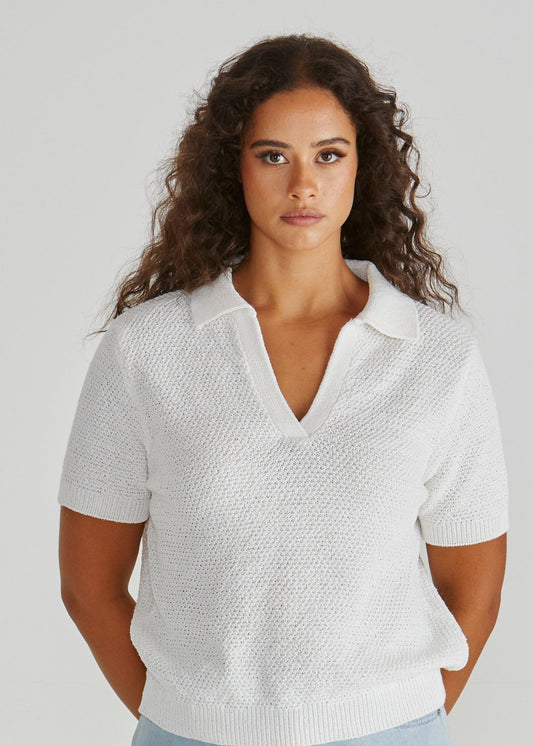 Lady wearing the Aubrie Knit Polo in White.  Giving vintage sporty style. Elegant knit top. Available at Loloma Living in Tamborine Mountain- stockist of SASS and Betty Basics.