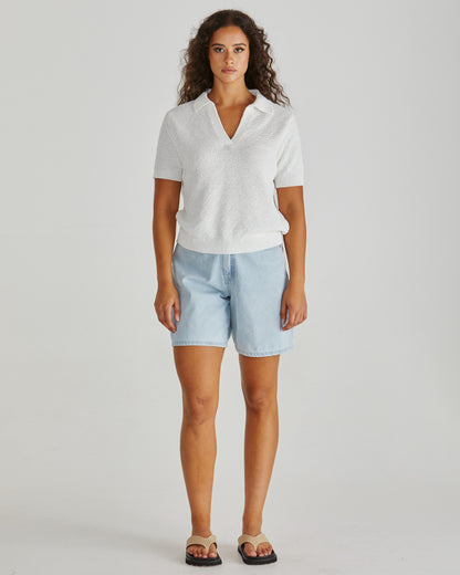 Lady wearing the SASS Aubrie Knit Polo in White.  Giving vintage sporty style. Elegant knit top. Available at Loloma Living in Tamborine Mountain- stockist of SASS and Betty Basics.